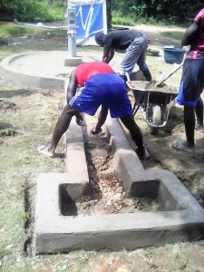 Finishing the African water well apron